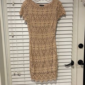 Women’s mid length tan lace overlay dress. Side zipper size small